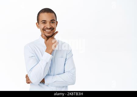 Handsome smiling man looking confident and professional, wearing office blue collar shirt, white background Stock Photo