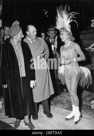 Oslo 19530821: The art runner Sonja Henie visits Oslo with her ice show. This is the first season Henie's show is in Norway. Here, Henie greets Crown Prince Olav and Crown Princess Märtha who attends one of the performances at Jordal Amfi. From NTB archive Stock Photo