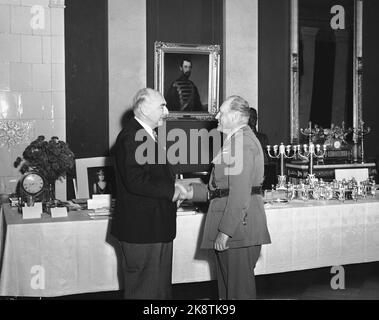 Oslo 19530702. Crown Prince Olav 50 years. Crown Prince Olav (t.h.) during the morning reception at the castle. Here the crown prince greets ambassador Ray. Photo: VALLDAL NTB / NTB Stock Photo