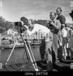 Hankø in the summer of 1956. Recording Norway's first feature film in color, titled 'Smugglers in tuxedo'. Here photographer Finn Bergan in action, together with producer Per G. Jonson (with a camera). Photo: Aage Storløkken / Current / NTB. Stock Photo