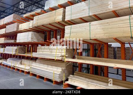 Wood factory stock or timber in warehouse. Piles of wooden boards waiting for shipping. Lumber, Business, production, manufacture and woodworking industry concept Stock Photo