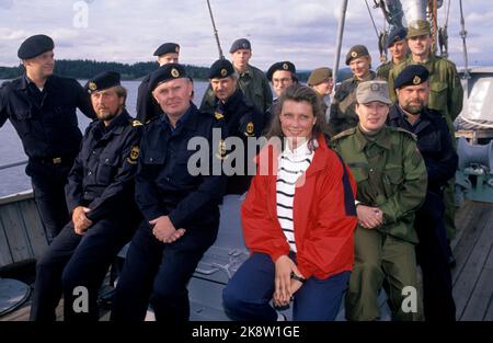 August 1990 - Princess Märtha Louise visits the Armed Forces. Here she sits with soldiers in uniform. Photo: Knut Falch / NTB Stock Photo