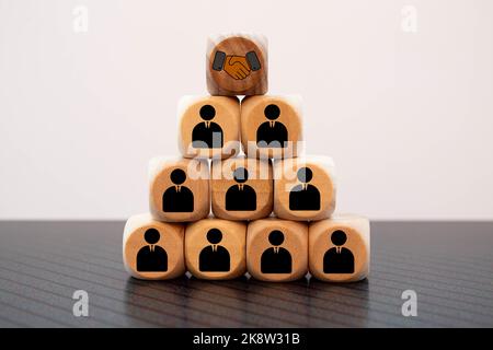 Figures blocks of people connected by lines on a blue background. Communication and interaction, building business relationships. Team building, distr Stock Photo