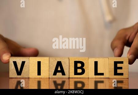 viable colorful word on the wooden background. Stock Photo