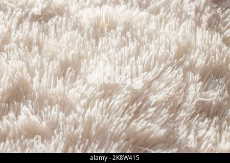 Texture of fluffy white artificial plaid, close up Stock Photo