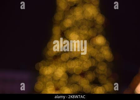 Christmas trees lights. Christmas garland blurred out. Defocused Photo. Stock Photo