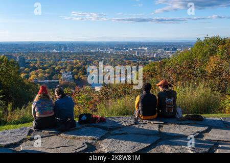 Montreal, CA - 10 October 2022: People looking at the view over Montreal city from Outremont lookout in Autumn Stock Photo