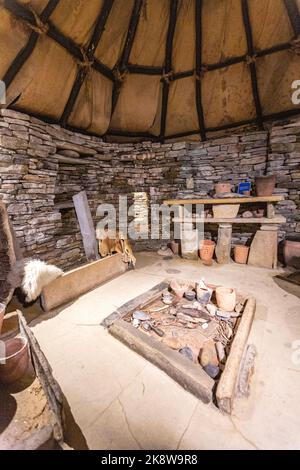 Reconstruction of a dwelling, Skara Brae, stone-built Neolithic settlement, located on the Bay of Skaill , Neolithic, Mainland, Orkney, Scotland, UK Stock Photo
