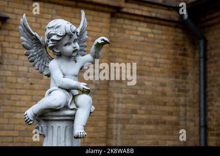 figure of an angel made of white plaster. Stock Photo