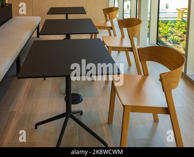 Empty modern classroom or training room with chairs and tables. Conference table, chairs at lobby. Nobody, selective focus Stock Photo