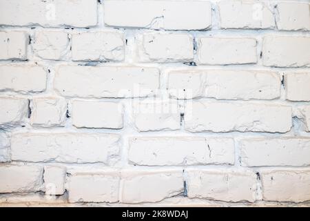 deep cracked white silicate brick wall closeup texture and background. Stock Photo
