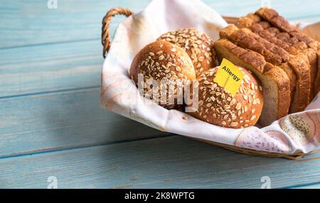 Allergy label on wheat oat bread. Allergic gluten intolerance concept. Stock Photo