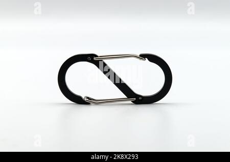 Black and silver carabiner isolated on white background Stock Photo