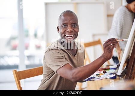 Painting is incredibly relaxing. a man painting in a art studio. Stock Photo