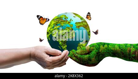 Concept Save the world save environment The world is in the grass of the green bokeh background Stock Photo