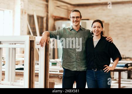 Were two of the best in this industry. Portrait of two young carpenters at work in their workshop. Stock Photo