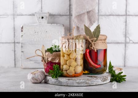 Pickled vegetables in glass jars. Stock Photo