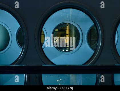 Apparent gameof circles, reflections and night lights in the small town of Nova Gorica Stock Photo