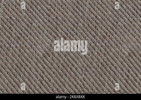 Texture of beige fabric of large herringbone weave. Stock Photo