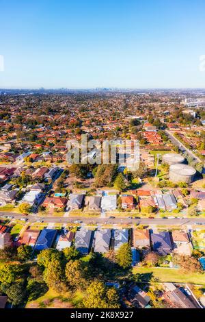 Vertical aerial panorama over City of Ryde residential suburbs in Western Sydney with a view towards distant city CBD. Stock Photo