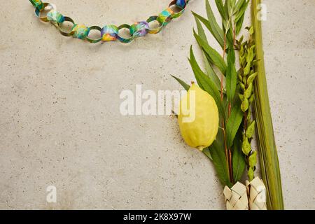 Jewish festival of Sukkot. Traditional symbols Etrog and lulav - citrus and palm. Stock Photo