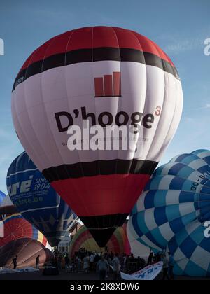 Sint Niklaas, Belgium, September 04, 2022, D'hooge hot air balloon is inflated among many other balloons Stock Photo