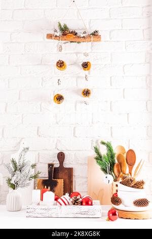 ceramic, wooden objects and decorations for the new year made of eco materials. vertical view of the part of the kitchen, decorated for the holiday Stock Photo