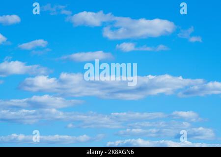 Clouds, beautifully white a fluffy, float in the blue sky. Zimbabwe, Africa Stock Photo