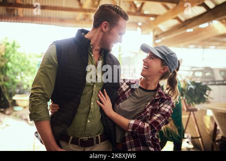 Well grow old together on this farm. a happy young couple relaxing together at their farm. Stock Photo