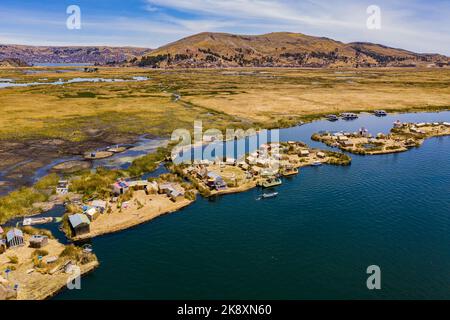 Aerial view of the Uros Straw Floating Islands on Lake Titicaca near Puno, Peru. Stock Photo