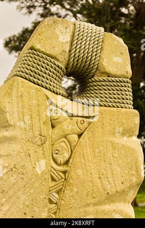 A closeup of stony sculpture bound with ropes Stock Photo - Alamy