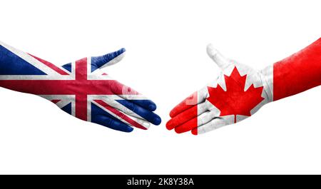 Handshake between Canada and United Kingdom flags painted on hands, isolated transparent image. Stock Photo