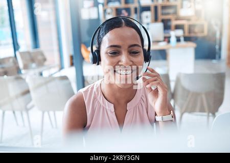 Telemarketing, customer support consultant and receptionist in call center with a headset. Happy, expert and contact us professional woman employee Stock Photo