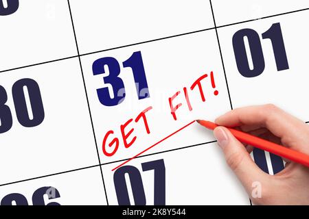 31st day of the month.  Hand writing text GET FIT and drawing a line on calendar date. Save the date. Get in shape reminder. Get Fit Health Physical T Stock Photo