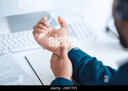Hands of business man with pain, carpal tunnel syndrome or strain from corporate job, working or typing on keyboard. Arthritis risk, hurt and wrist of Stock Photo