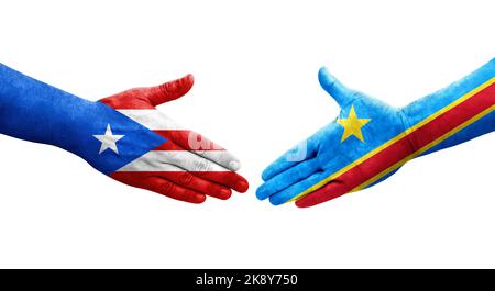 Handshake between Dr Congo and Puerto Rico flags painted on hands, isolated transparent image. Stock Photo