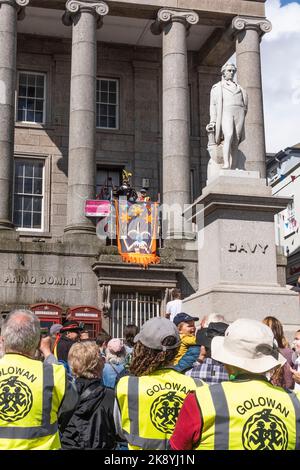 Phil Northcott the Penzance Town Crier standing on the balcony welcoming the crowd at the start of the Mazey Day celebrations during the annual Golowa Stock Photo