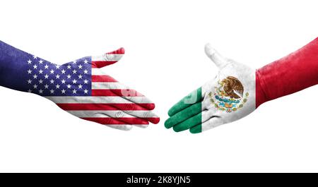 Handshake between Mexico and USA flags painted on hands, isolated transparent image. Stock Photo