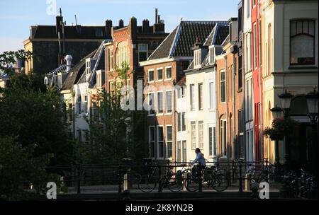 Amsterdam, Netherlands - June 21, 2010: Cyclist in Amsterdam. Amsterdam is one of the worlds most bicycle friendly cities, in the center of Amsterdam Stock Photo