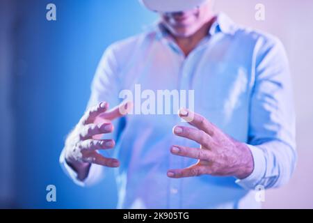Virtual reality, 3d glasses and man hands for business metaverse experience, futuristic innovation or software technology in neon studio. Future, ai Stock Photo