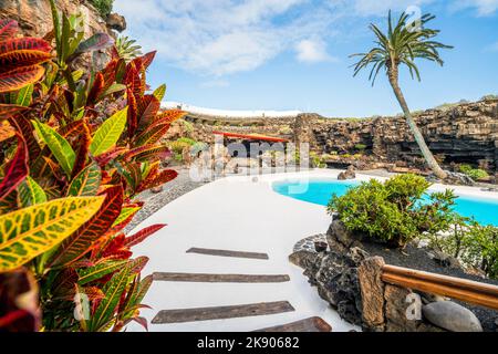 Amazing cave, pool, natural auditorium, salty lake designed by Cesar Manrique in volcanic tunnel called Jameos del Agua in Lanzarote, Canary Islands, Stock Photo