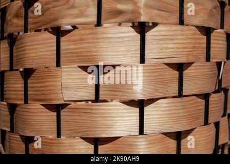 Flower pod decorated by wood veneer. A full frame brown wood veneer surface. Wood veneer texture backlight close up Stock Photo