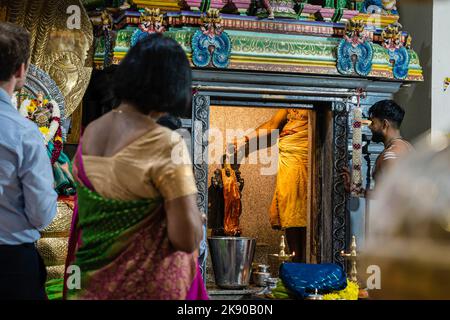 A pandit or Hindu priest performs Abhishekam puja, a Hindu ritual of ...
