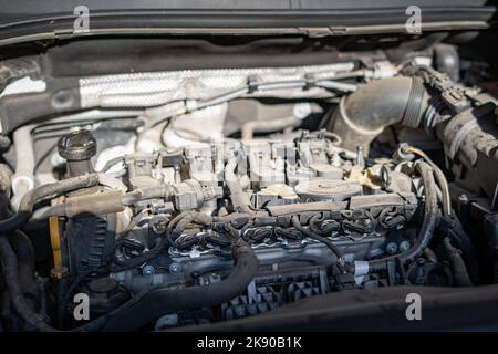 Car Under Hood Close Up, View Of A Red Engine With Big Black Round Air  Intake Filter, Tubes, Wires, Pipes, Mechanical And Electrical Other Parts  Stock Photo, Picture and Royalty Free Image.