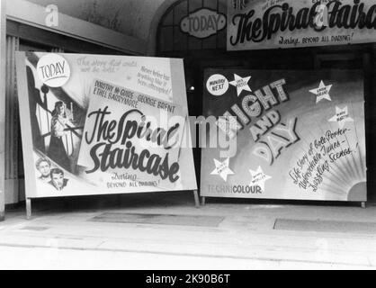 Unidentified Military Cinema A.K.C. (ARMY KINEMA CORPORATION) Garrison Cinema / Movie Theatre showing DOROTHY McGUIRE GEORGE BRENT and ETHEL BARRYMORE in THE SPIRAL STAIRCASE 1946 (director Robert Siodmak) in circa late 1946 in post war Germany with billboard for forthcoming CARY GRANT as Cole Porter in NIGHT AND DAY (director Michael Curtiz) Stock Photo