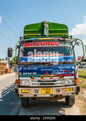 TANZANIA, DAR ES SALAAM - JULY 23, 2016: colorful overland truck to serve the highway to Dar Es Salaam. Roads are the main transportation way in Tanza Stock Photo