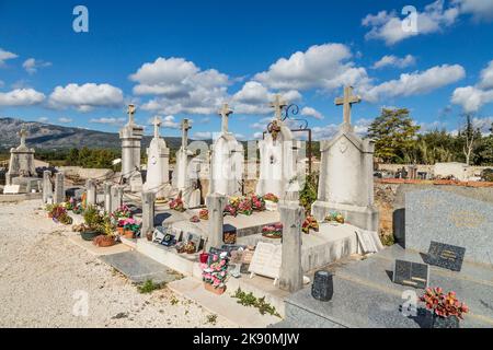POURRIERES, FRANCE - OCT 22, 2016: old graves at the cemetery. The small old cemetery of Pourrieres is classified as historical monument. Stock Photo