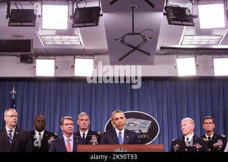 United States President Barack Obama delivers remarks after meeting with members of his national security team concerning ISIS at the Pentagon in Washington, DC on Monday, July 6, 2015. From left, Deputy Secretary of Defense Robert O. Work, Commander of U.S. Central Command Gen. Lloyd Austin, Secretary of Defense Ashton Carter, Commander of U.S. Africa Command Gen. David Rodriguez, Chairman of the Joint Chiefs of Staff U.S. Army General Martin Dempsey and Commander of U.S. Special Operations Command Gen. Joseph L. Votel. Credit: Drew Angerer/Pool via CNP Stock Photo