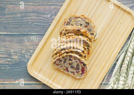 raisin and Cranberry slice of bread on table  Stock Photo