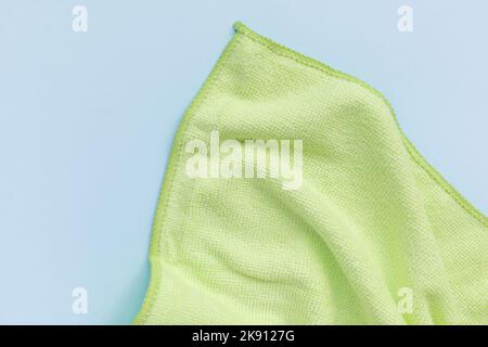 Yellow microfiber cloth for cleaning. Cleaning micro fabric towels for dusting and polishing. Domestic household cleaning service concept. Close up, copy space Stock Photo
